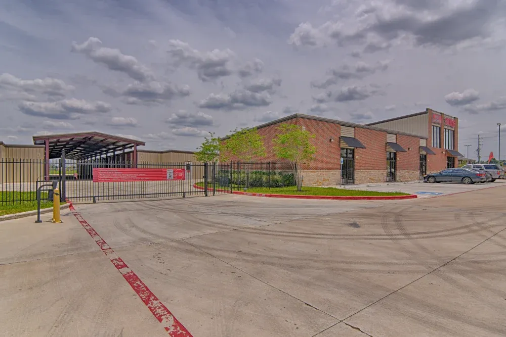 Gated entry and spacious parking lot at Klein Krimmel Self Storage.