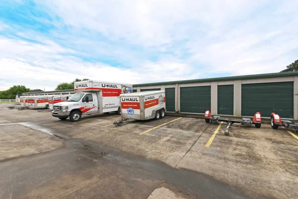 Outdoor storage units with parked U-Hauls at AAA Self Storage in Hockley.