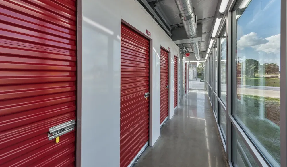 Indoor, climate-controlled storage aisle by a window at Bergstrom Storage.