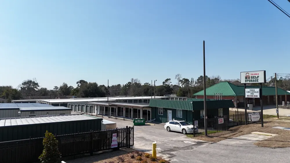 Street view of Columbia Self Storage facility with gated access.