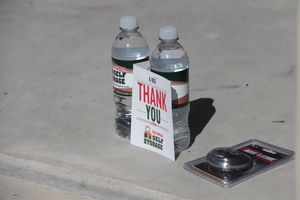 View of water bottles and "thank you" sign at Columbia Self Storage.