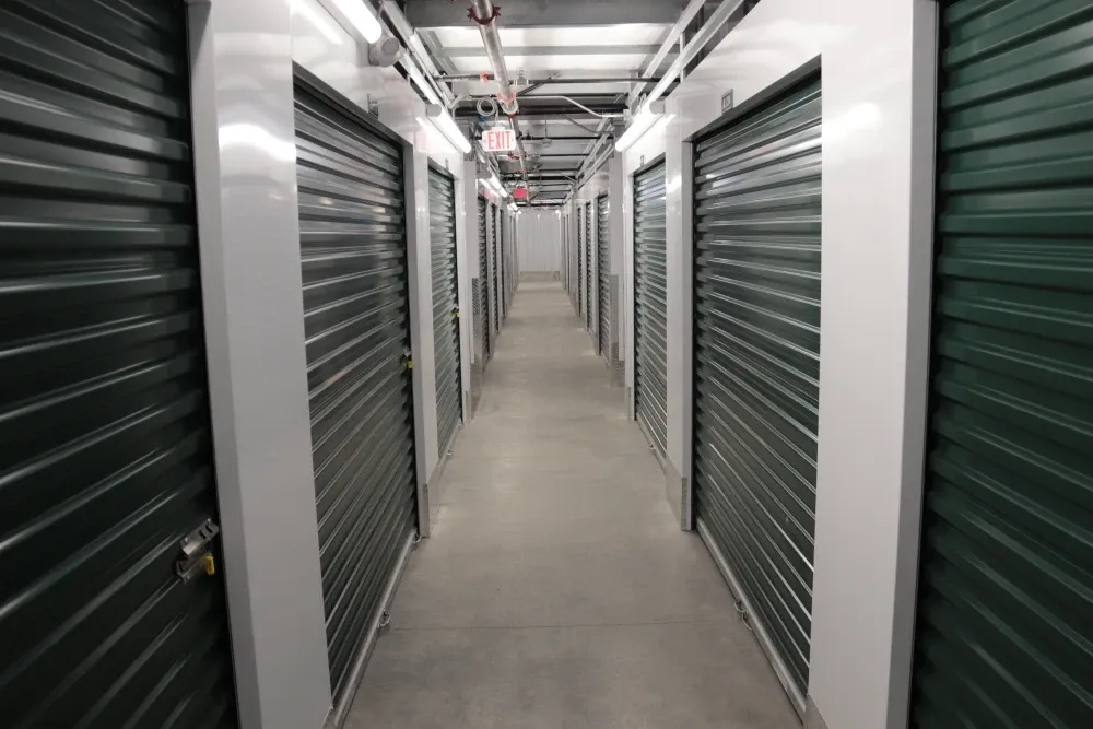 Aisle of indoor storage units at Columbia Self Storage.
