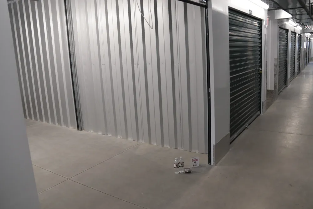 Indoor storage unit with rolled up door at Columbia Self Storage.