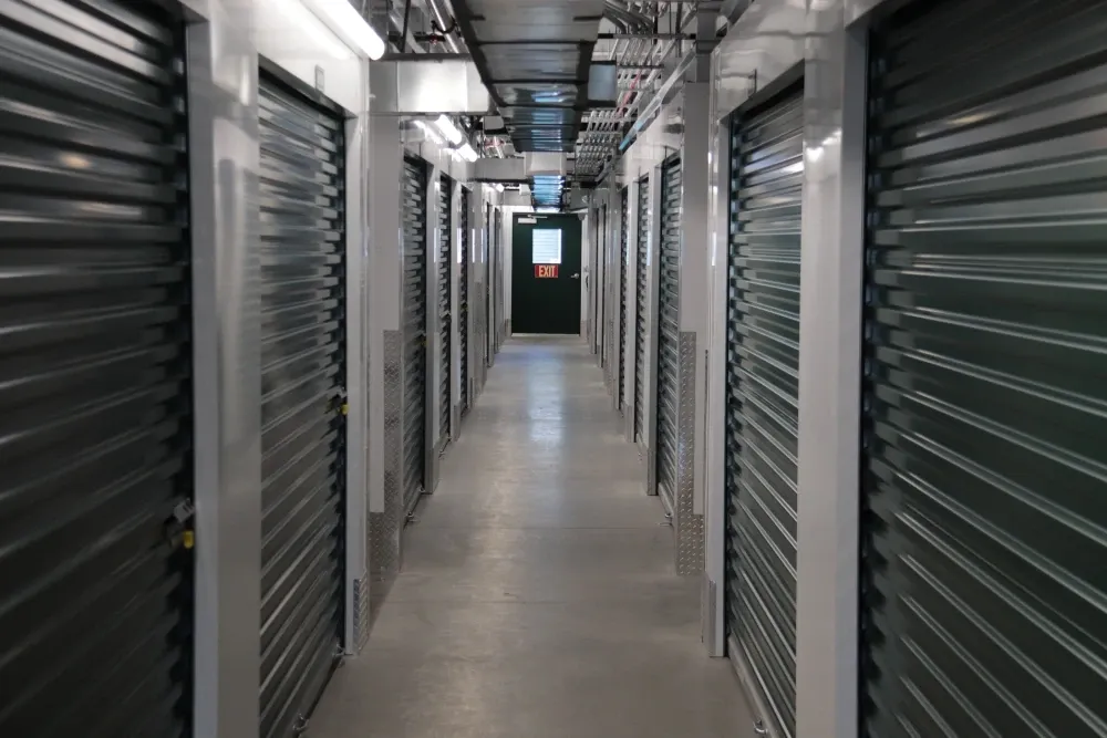 Climate-controlled storage hallway with lighting and ventilation at Columbia Self Storage.