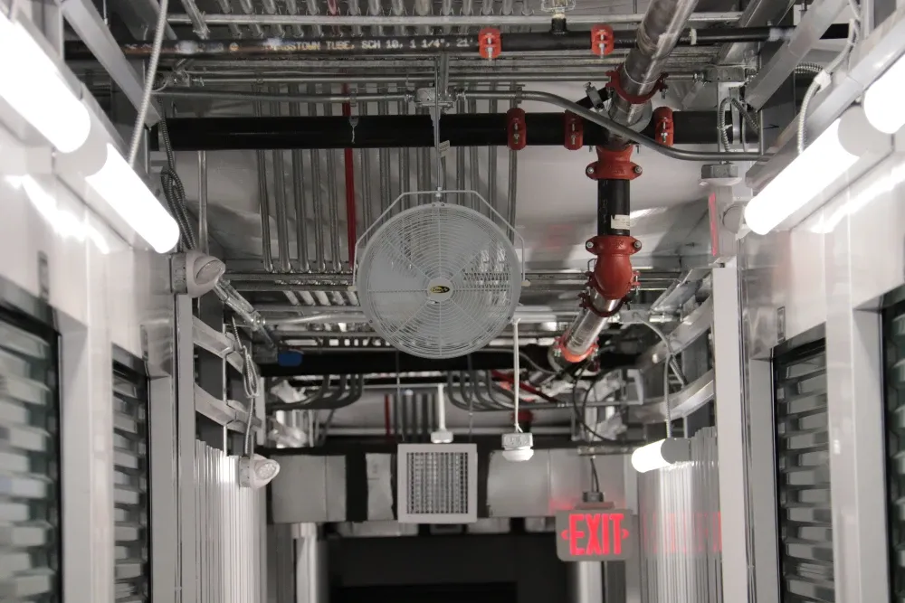 Climate-controlled storage hallway with lighting and ventilation at Columbia Self Storage.
