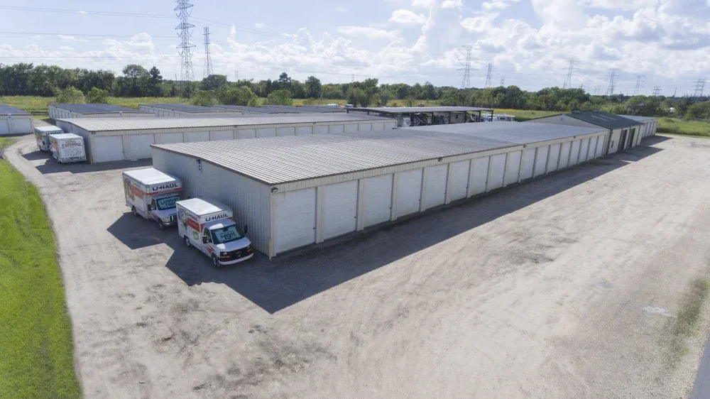 Skyview of Guardian Storage facility with parked U-Haul trucks.