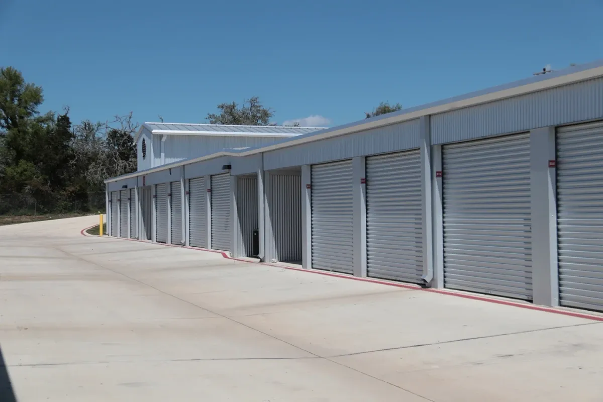 White doored outdoor storage units at the Dripping Springs storage facility
