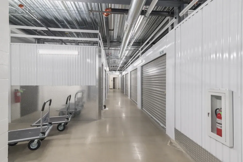 Indoor storage unit with carts at Lakeline Storage facility.