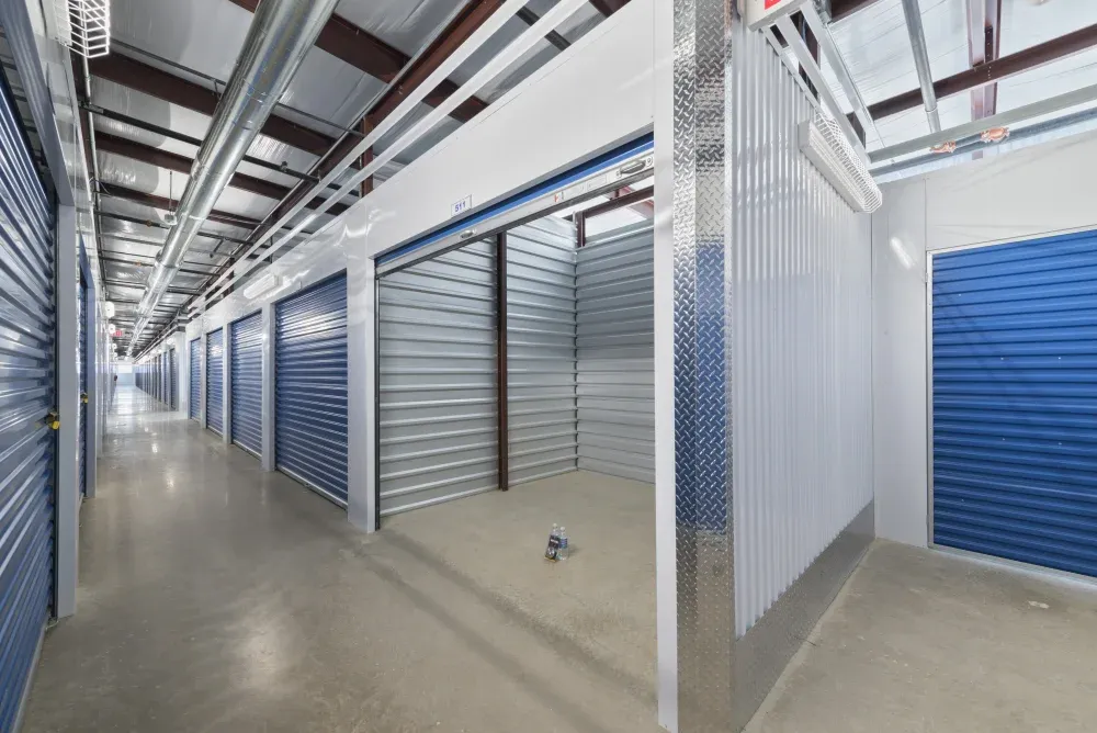 Indoor storage with rolled up door at Westpointe New Braunfels Self Storage.