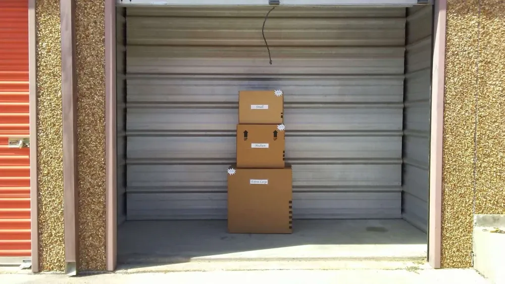 Self-storage unit with boxes inside at Northwest Hills Self Storage.