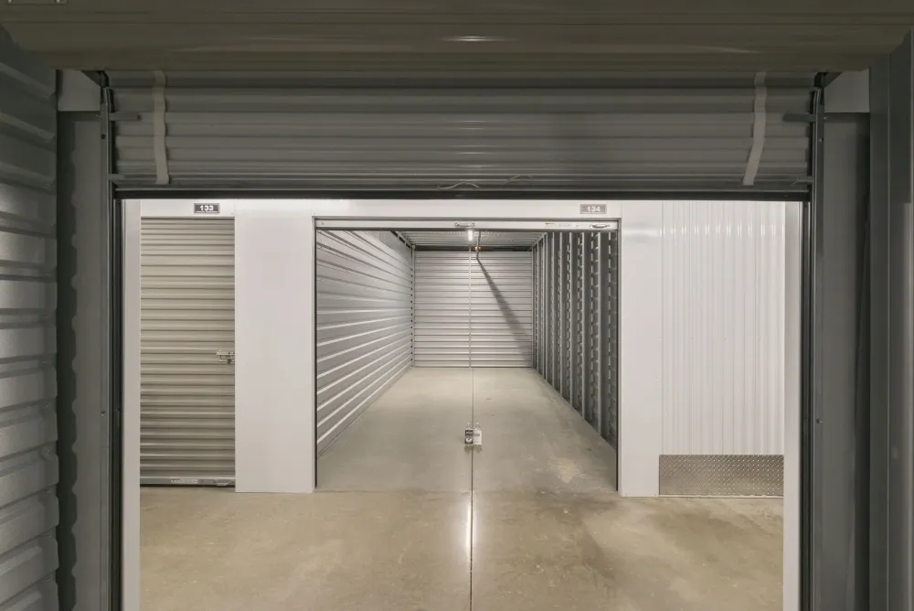 Open climate-controlled storage unit with roll-up door at Southlake Storage.