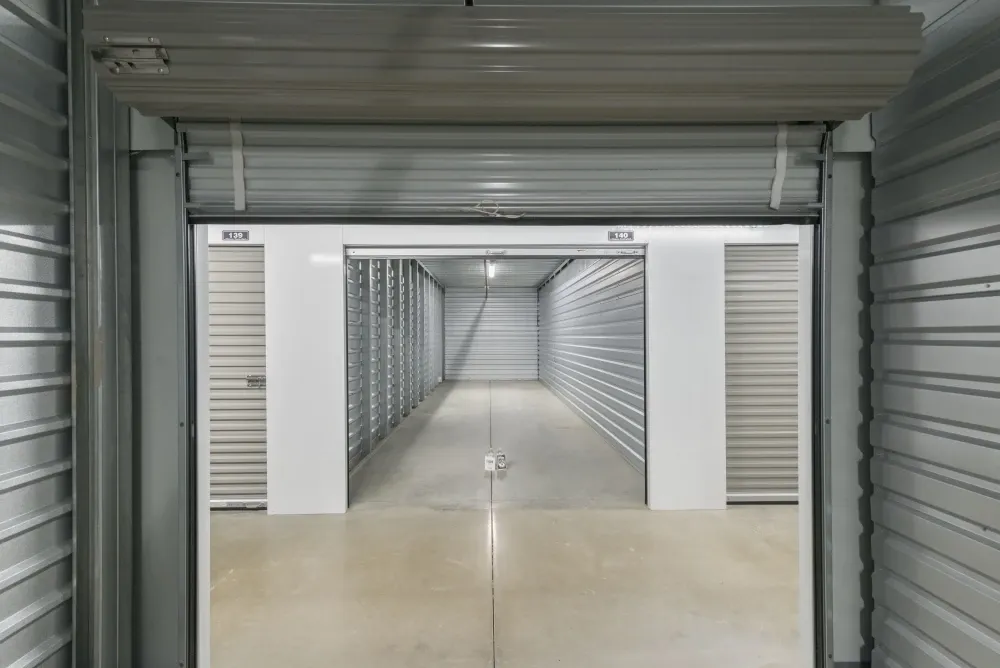 Open climate-controlled storage unit with roll-up door at Southlake Storage.