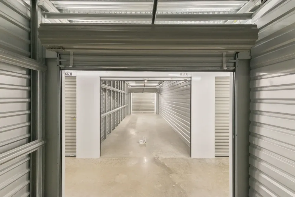 Open climate-controlled storage unit with roll-up door at Southlake Storage.