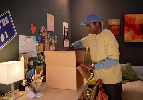 Person packing for college