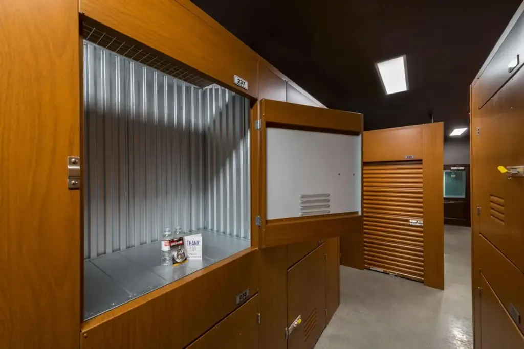 Open wine locker with bottles of liquor