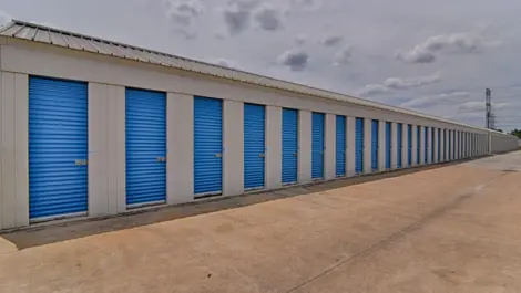 Aisle of small, outdoor drive-up storage units at My Storage.