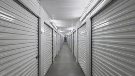 Aisle of indoor, climate-controlled storage units at AAA Self Storage.