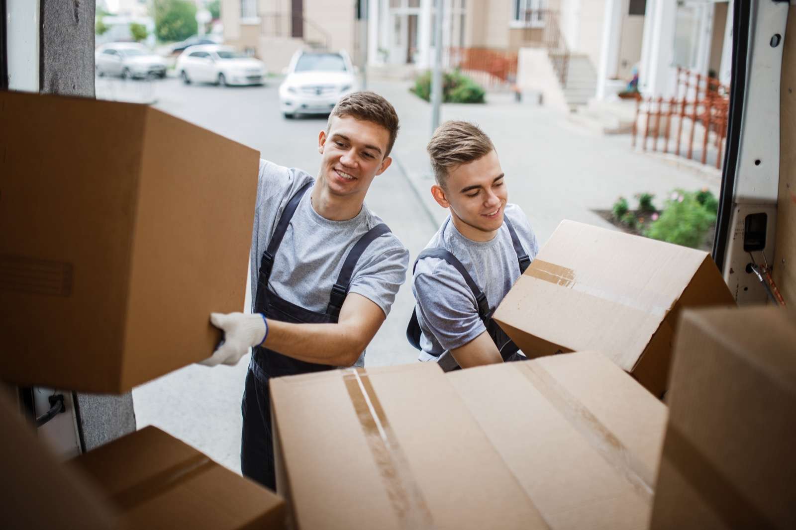 Movers placing boxes in a moving truck